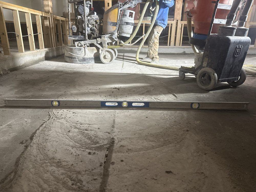 Diamond grinding a concrete slab to prep it for an epoxy coating