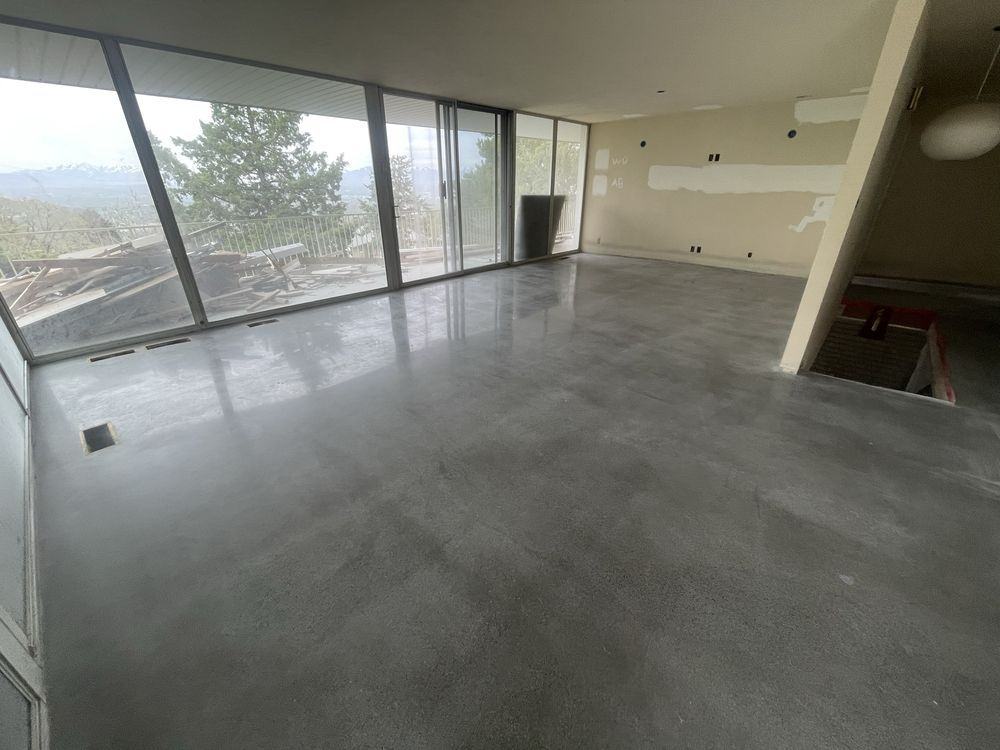 Polished concrete floor in a mountain home with valley views